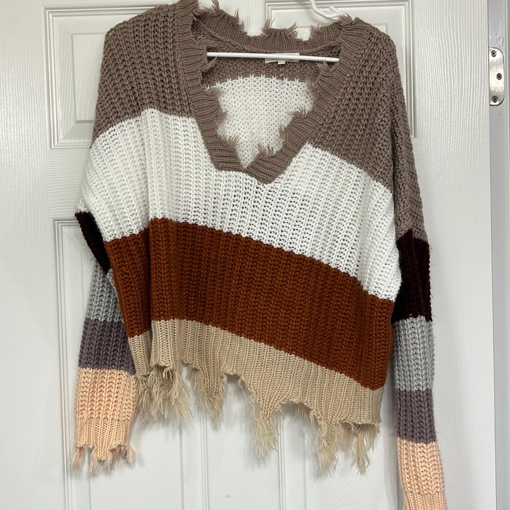 Multicolored fall sweater with frayed ends in a S/M